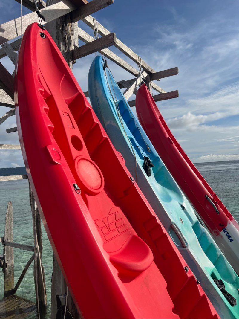 Kayaks hanging off wooden dock